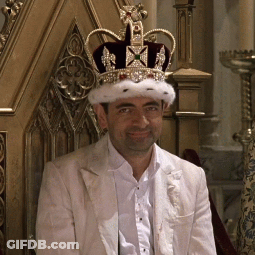 Man With Crown Sitting In Chair GIF
