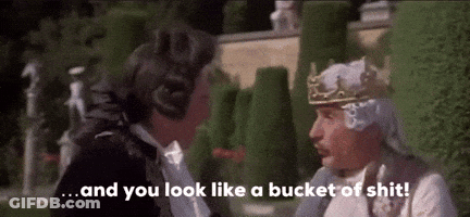 Man With Crown Talking To Man In Tuxedo GIF