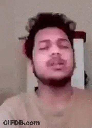Man With Curlers Singing GIF