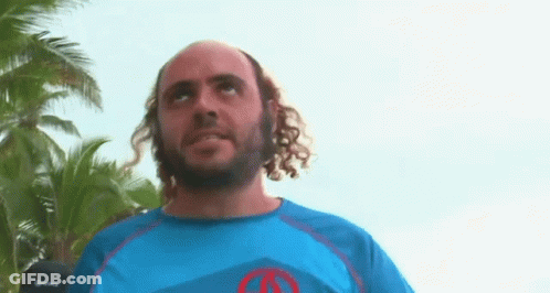 Man With Curly Hair And Beard In Blue Shirt With Red Circle GIF