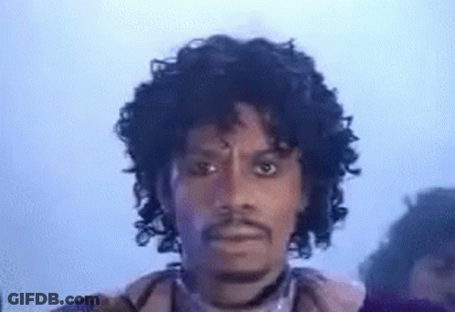 Man With Curly Hair And Beard In Purple Jacket GIF