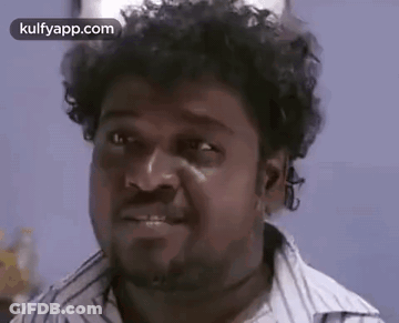 Man With Curly Hair And Beard Making Funny Face Smiling GIF