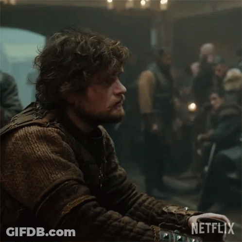 Man With Curly Hair And Beard Netflix Logo Dark Room GIF