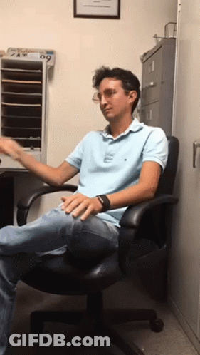 Man With Curly Hair And Beard Saying It's Quiet GIF