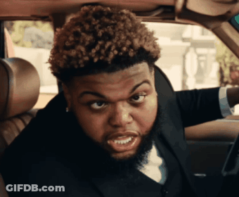 Man With Curly Hair And Beard Sitting In Car GIF