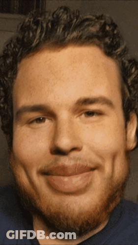 Man With Curly Hair And Beard Smiling GIF