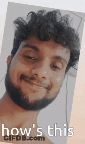 Man With Curly Hair And Beard Smiling GIF