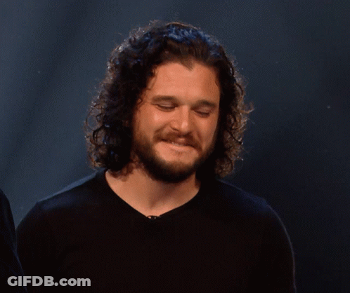 Man With Curly Hair And Beard Smiling GIF
