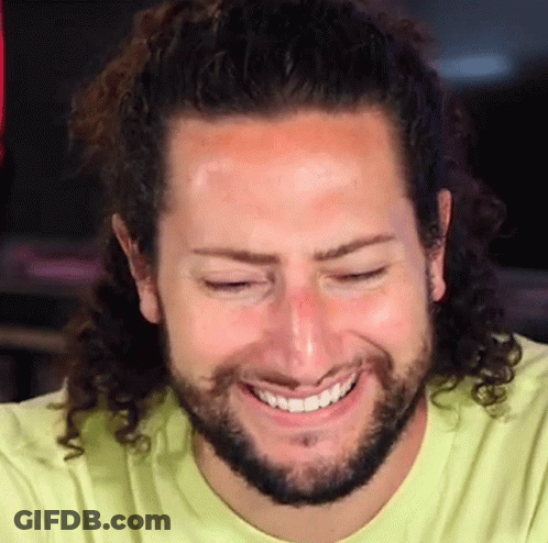 Man With Curly Hair And Beard Smiling GIF