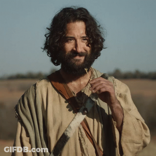 Man With Curly Hair And Beard Wearing Necklace With Pendant GIF