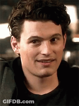 Man With Curly Hair And Black Shirt Smiling GIF