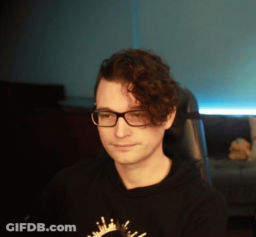 Man With Curly Hair And Glasses In Black Shirt GIF