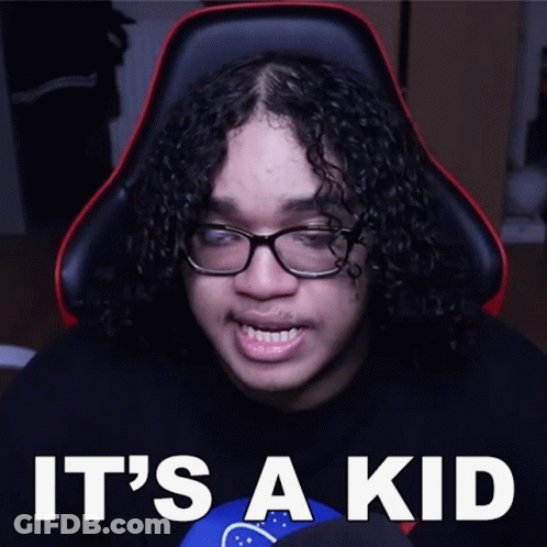 Man With Curly Hair And Glasses Sitting GIF