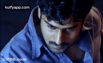 Man With Curly Hair And Mustache In Blue Shirt GIF