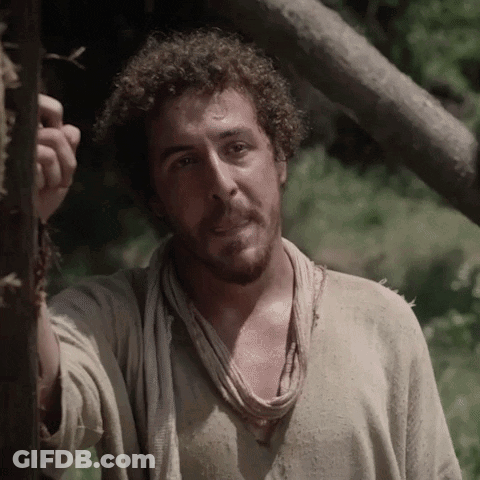 Man With Curly Hair And Scarf Next To Tree GIF
