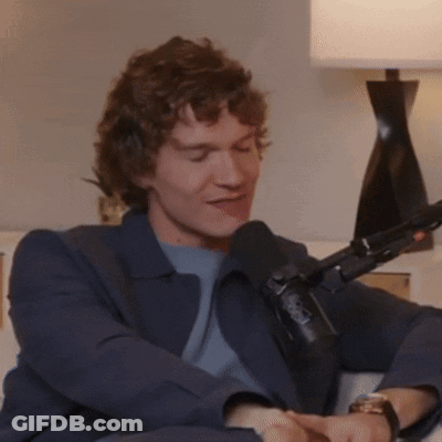 Man With Curly Hair At NBC Microphone GIF