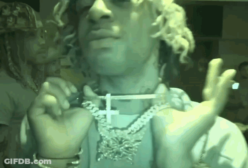 Man With Curly Hair Cross Necklace Smoking GIF