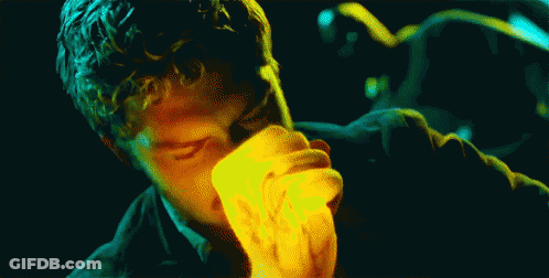 Man With Curly Hair Eating Yellow Item GIF