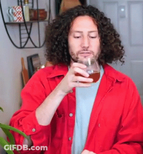 Man With Curly Hair Holding Beer GIF
