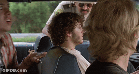 Man With Curly Hair In Back Seat GIF