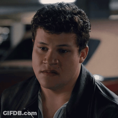 Man With Curly Hair In Black Jacket GIF