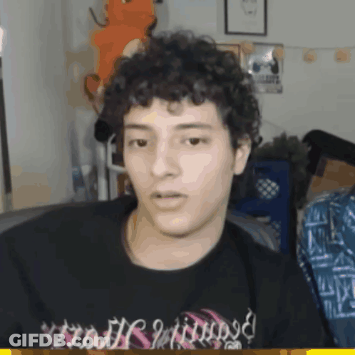 Man With Curly Hair In Black Shirt Saying Nightmare GIF