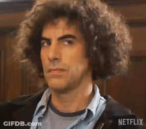 Man With Curly Hair In Denim Shirt And Jacket GIF