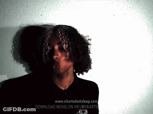Man With Curly Hair In Front Of Website GIF