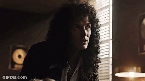 Man With Curly Hair In Front Of Window GIF