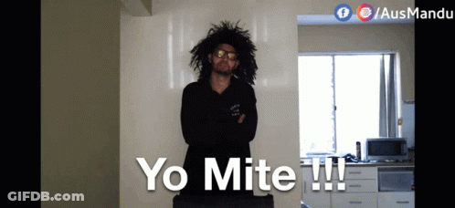 Man With Curly Hair In Front Of Yo Mite Wall GIF