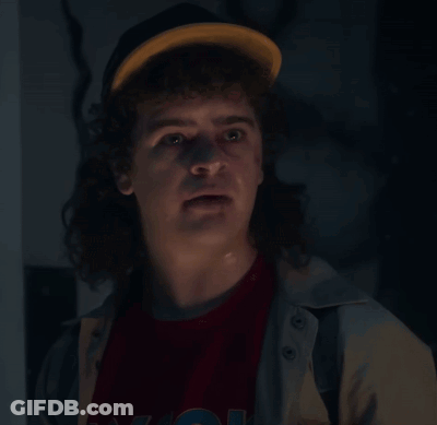 Man With Curly Hair In Hat And N.Y.C. T-Shirt GIF