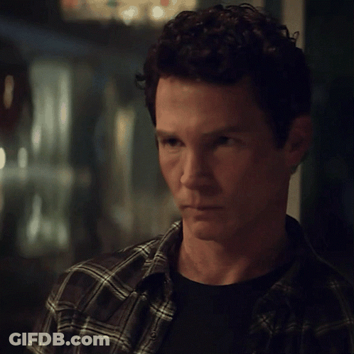 Man With Curly Hair In Plaid And Black Shirt GIF