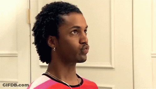 Man With Curly Hair In Red And Pink Striped Shirt And Earrings GIF