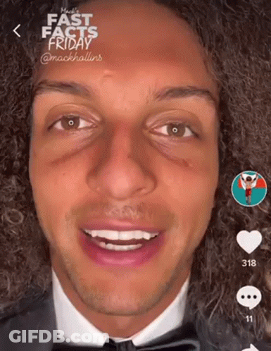 Man With Curly Hair In Suit And Bow Tie GIF