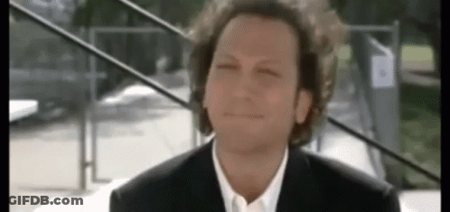 Man With Curly Hair In Suit And White Shirt GIF