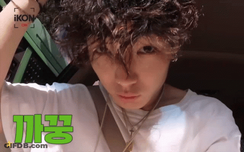 Man With Curly Hair In White Shirt Saying Ikon GIF