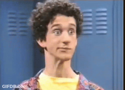Man With Curly Hair Making Funny Face At Locker GIF