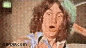 Man With Curly Hair Making Funny Face GIF