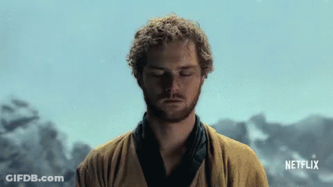 Man With Curly Hair Meditating In Front Of Netflix GIF
