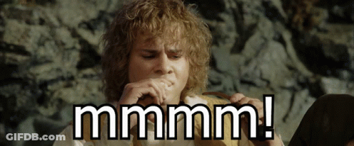Man With Curly Hair Playing Harmonica Saying Mmmm GIF