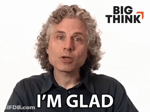 Man With Curly Hair Saying I'm Glad In Front Of Big Think Logo GIF