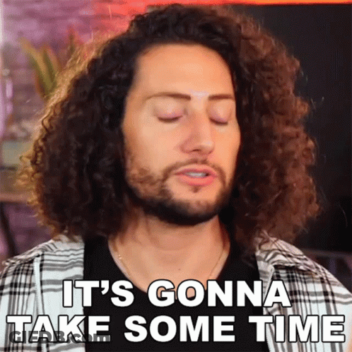 Man With Curly Hair Saying It Will Take Time GIF
