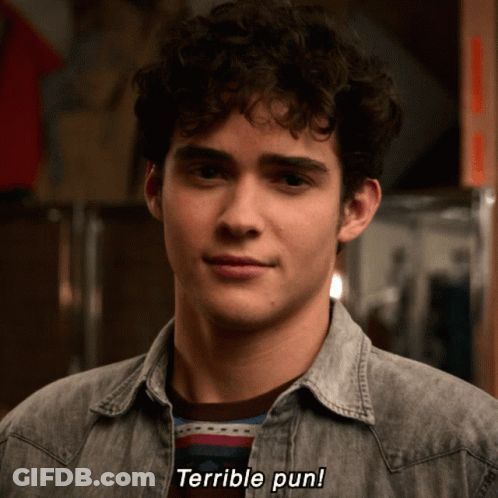 Man With Curly Hair Says Terrible Pun In Denim Shirt GIF