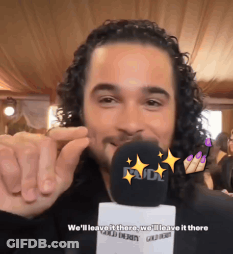Man With Curly Hair Talking Into Microphone GIF