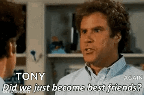 Man With Curly Hair Talking To Another Man GIF