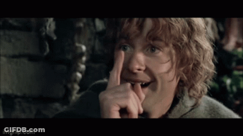 Man With Curly Hair Wearing Cape Holding Green Bag GIF