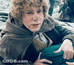 Man With Curly Hair Wearing Cape Holding Green Bag GIF