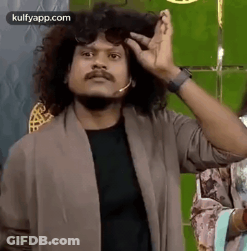 Man With Curly Hair Wearing Sunglasses And Microphone Making Funny Face GIF