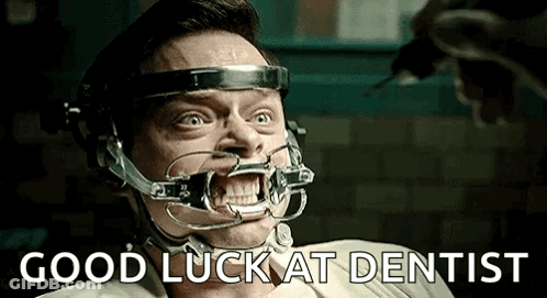 Man With Dental Brace Sitting GIF