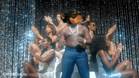 Man With Dog's Head Surrounded By Women GIF